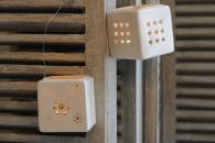 Hanging porcelain tea light holders